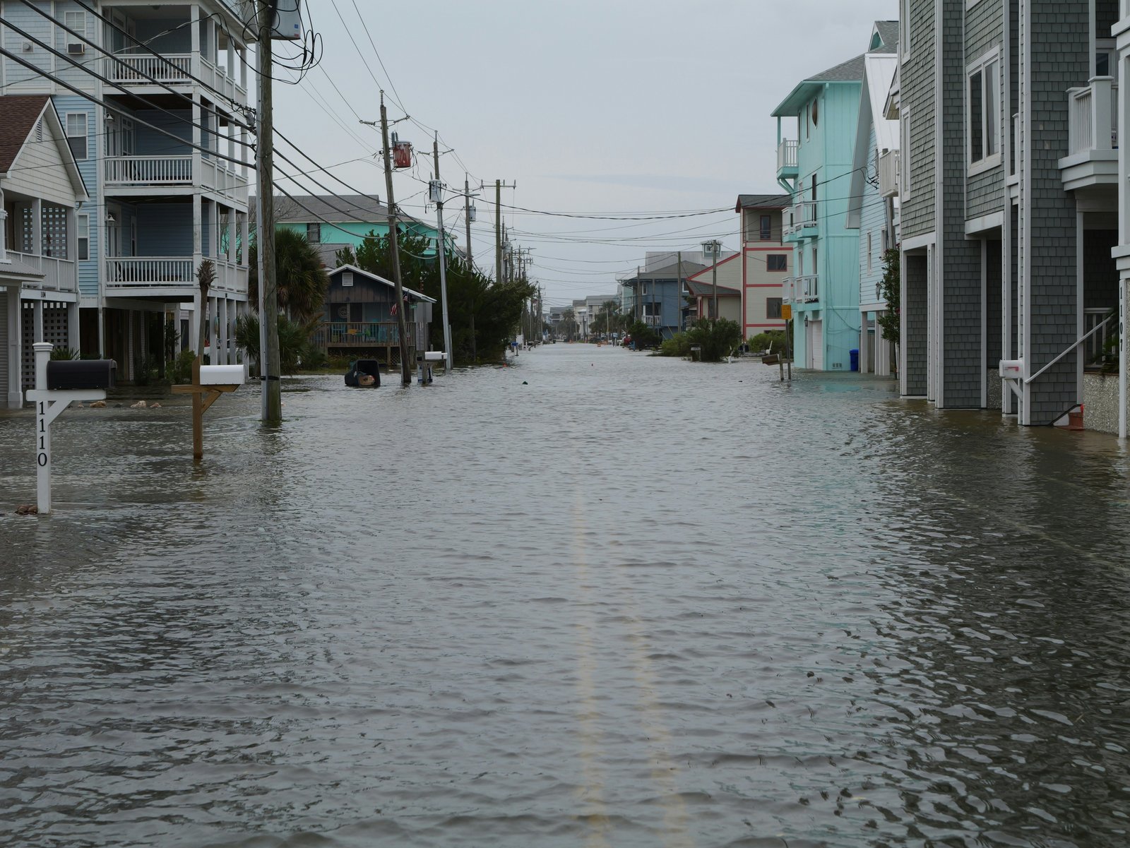 Flooded residential street — protect your home with flood insurance from Complete Insurance Agency